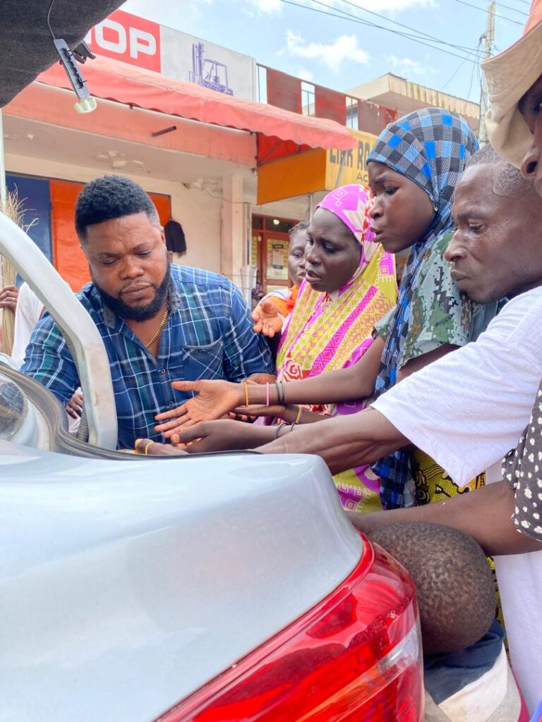 Feeding the blind on the street of Accra, Ghana